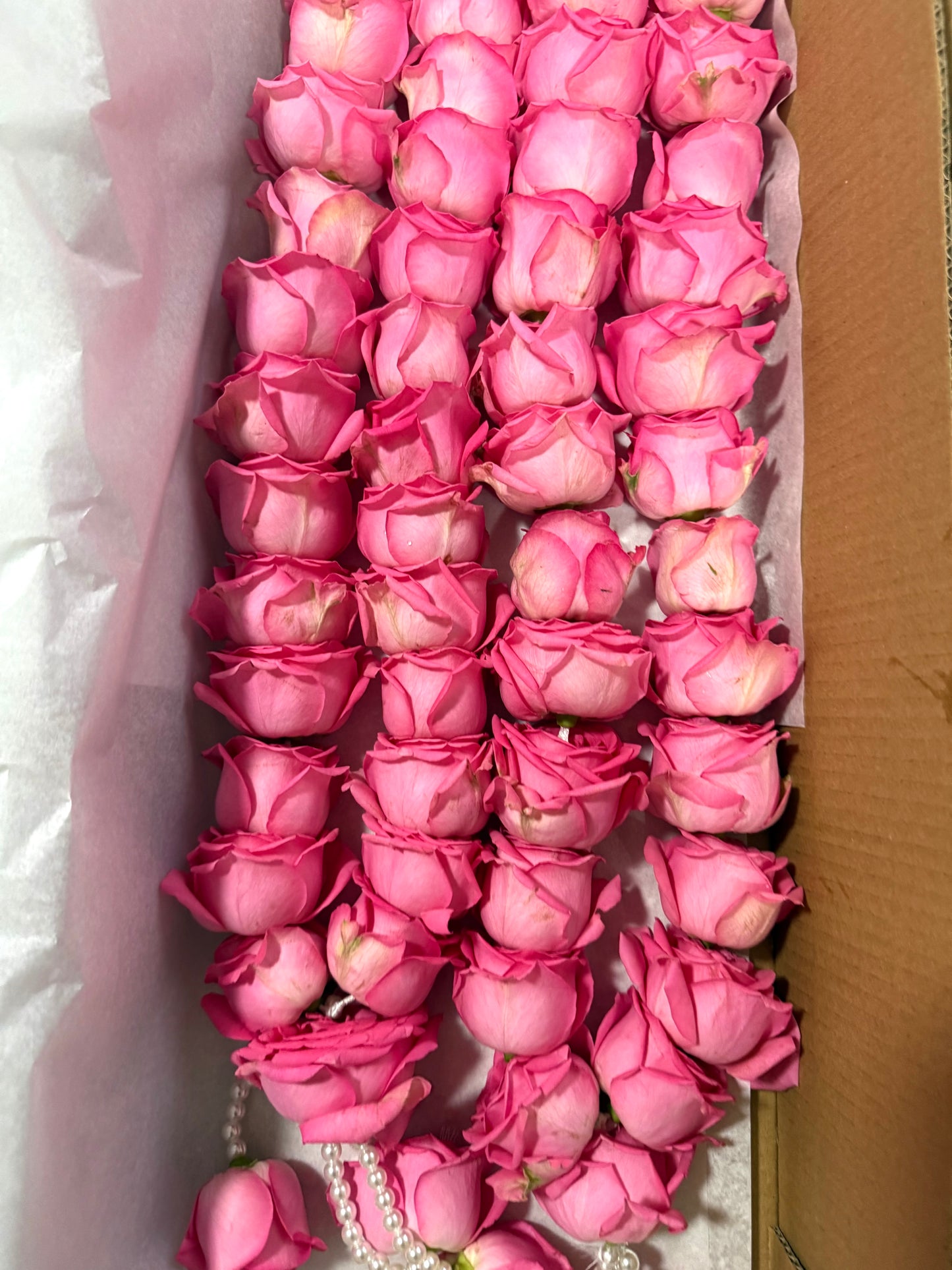 Pink rose with string of pearls garland