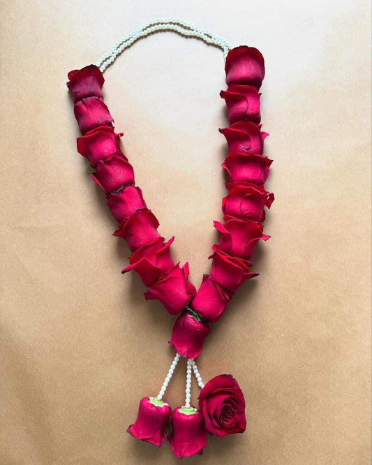 Red rose with string of pearls garland